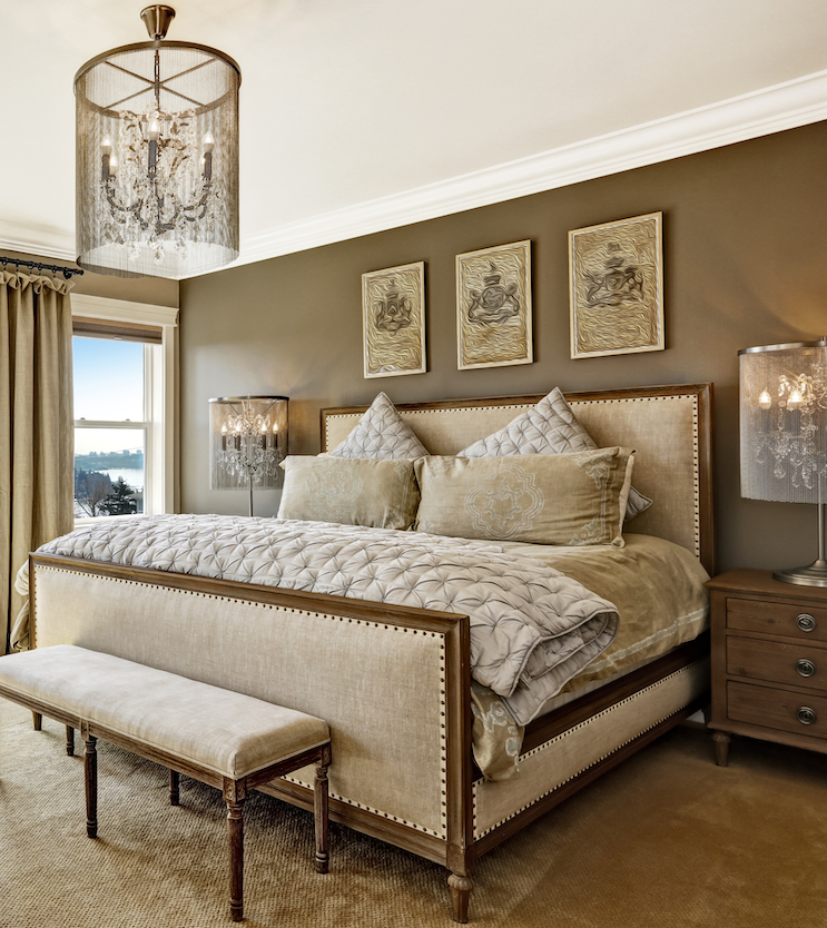 Luxury bedroom interior with rich furniture and scenic view from walkout deck